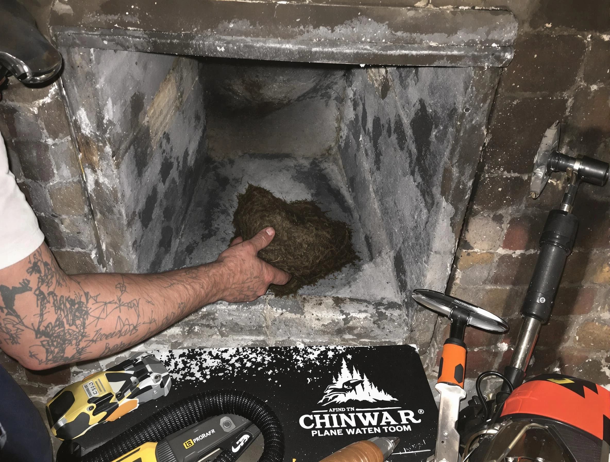 Petersburg Chimney Sweep safely removing debris and screening chimney in Petersburg, VA